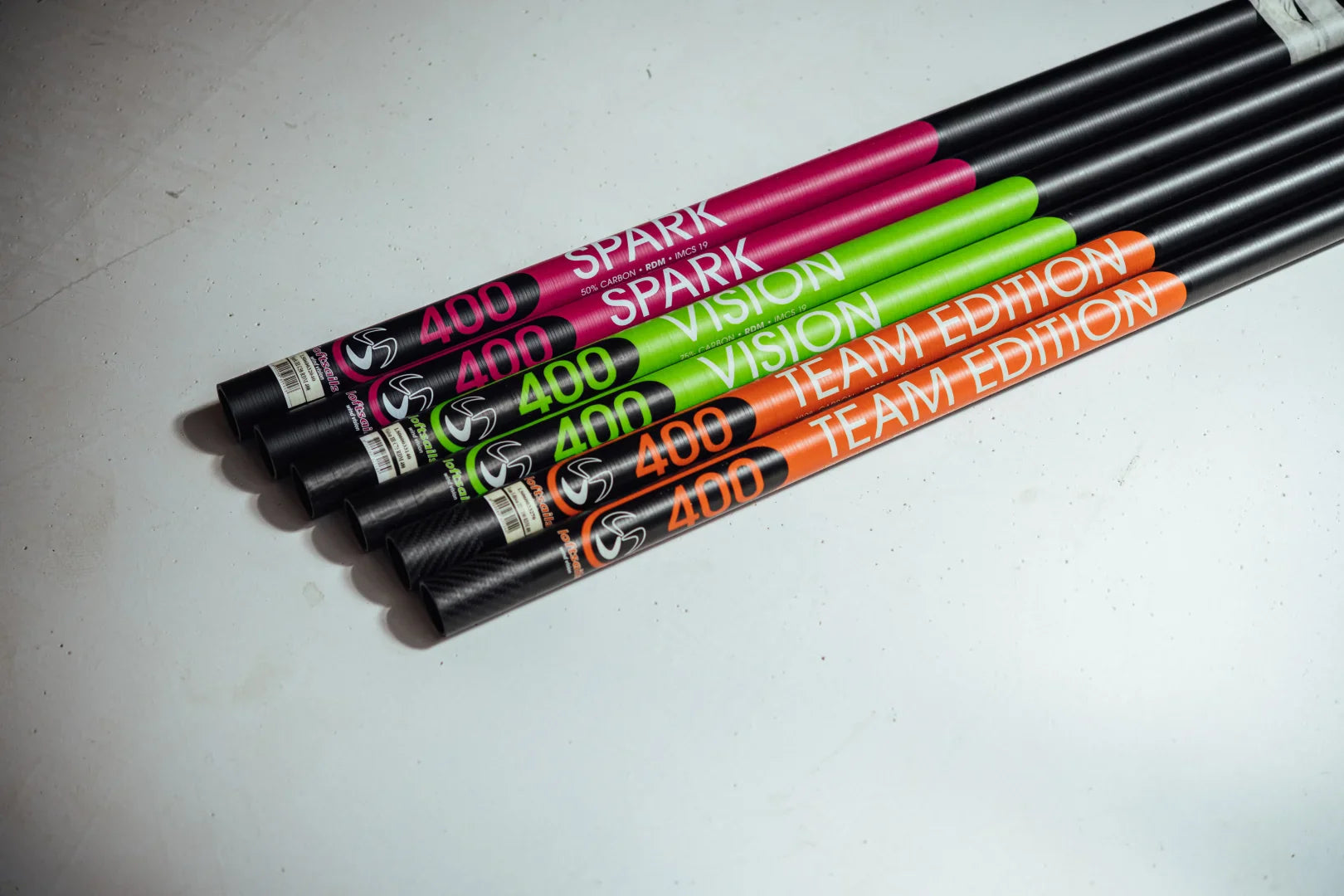 Loftsails windsurf masts—Spark, Vision, and Team Edition models color-coded and arranged side by side. collection