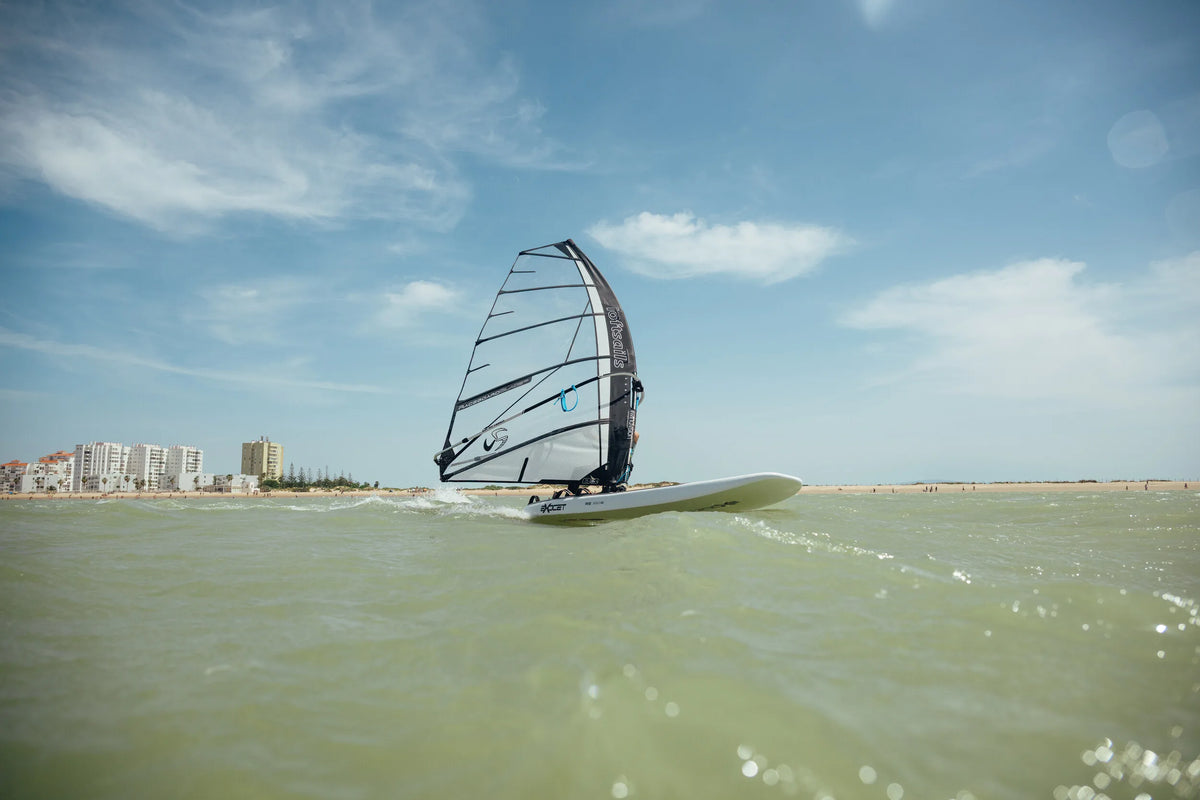 Raceboardblade OD sailing in front of the Cadiz skyline